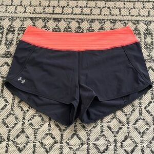 Under armor shorts. Size small. Color grey and orange